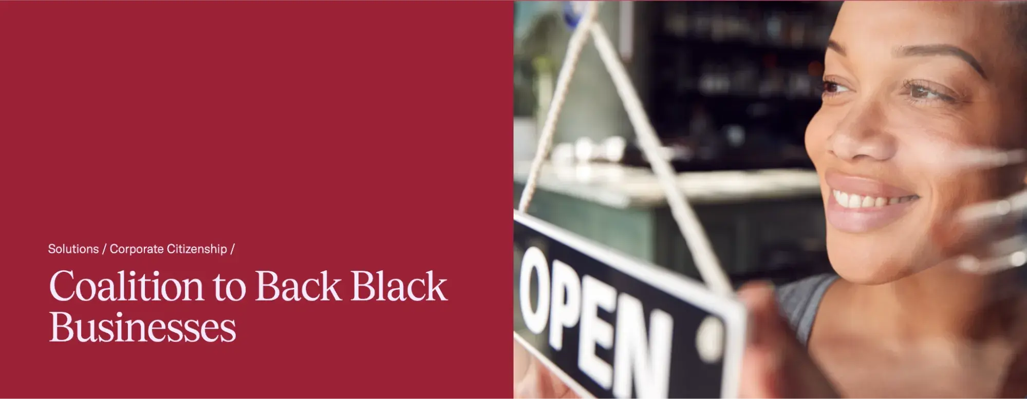a screenshot of the coalition to back black business homepage with a photo of a black female business owner flipping over an ‘open’ sign
